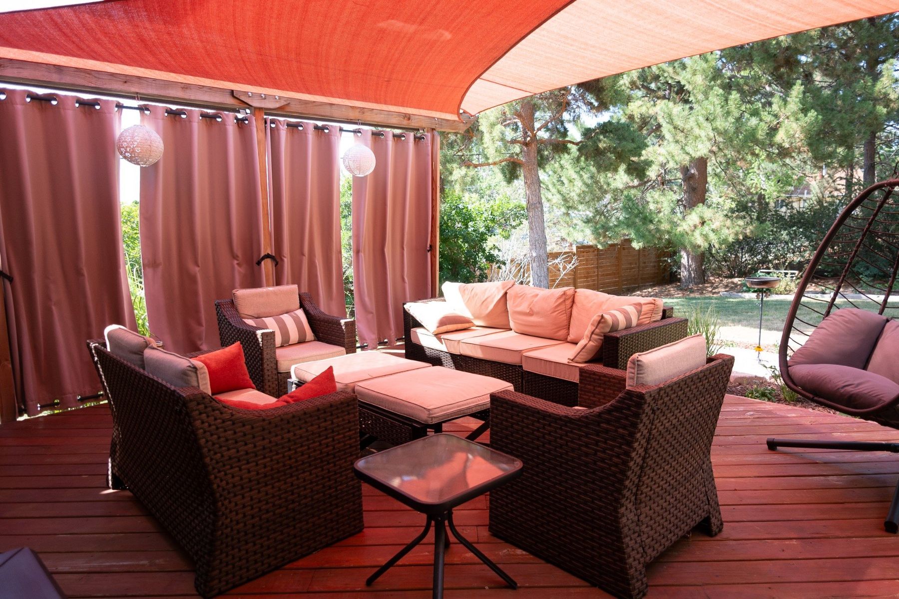 Covered backyard patio with outdoor seating